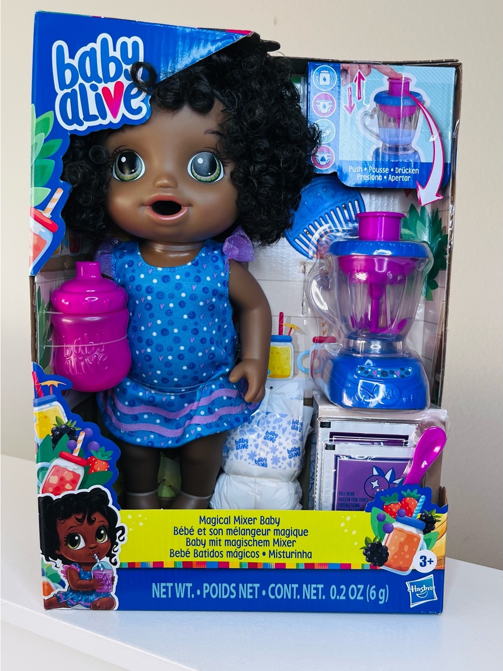 Hasbro Baby Alive Dark-Skinned Doll with Blue Polka Dot Dress and Purple Mixer